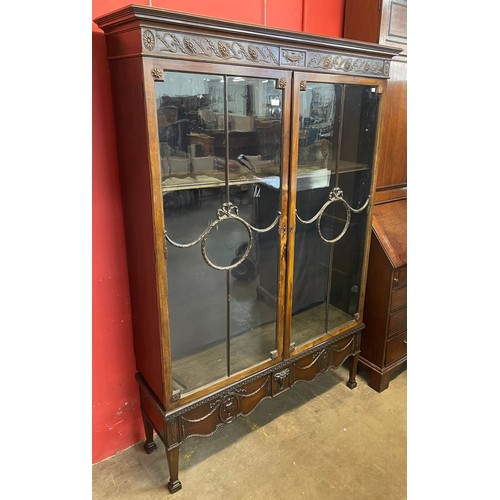 91 - An Edward VII Adams style carved mahogany two door bookcase