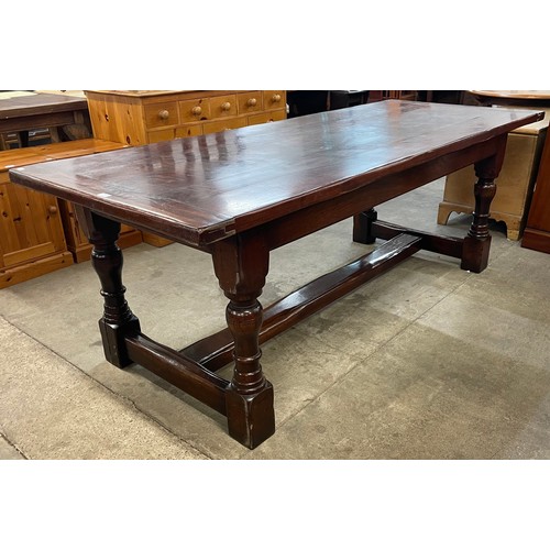 92 - A large George III style oak refectory table