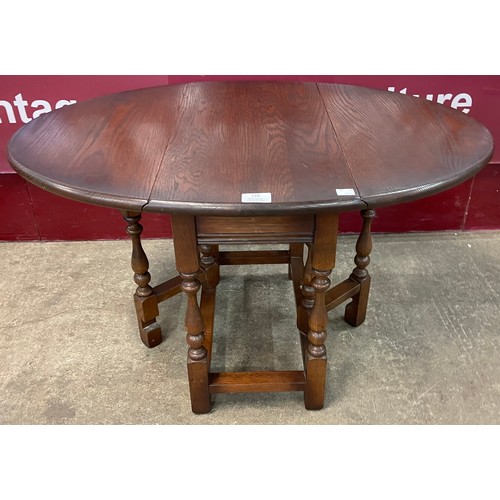 128 - An Old Charm oak gateleg occasional table