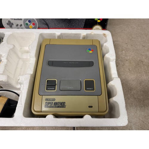 5117 - A Super Nintendo entertainment system with original box, power cable, wired controller and Super Mar... 