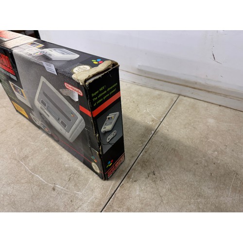 5117 - A Super Nintendo entertainment system with original box, power cable, wired controller and Super Mar... 