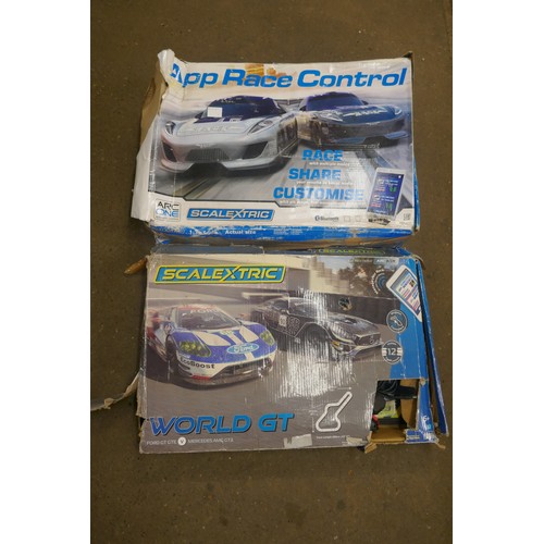 5325 - 2 boxed Scalextric sets and a box of spare parts