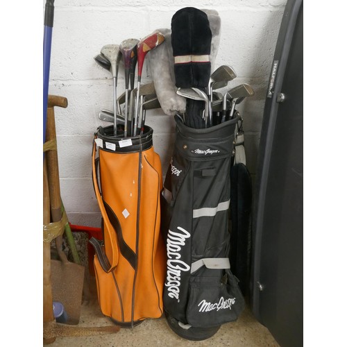 5327 - Two golf bags and a quantity of golf clubs  and a trolley