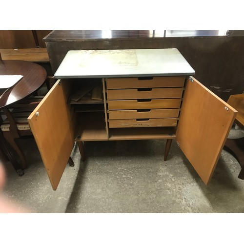 173 - A teak and Formica topped fitted cupboard