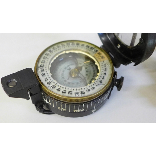 2013 - A WWII TG Co. Mk II compass in a leather case and a boxed reproduction sextant