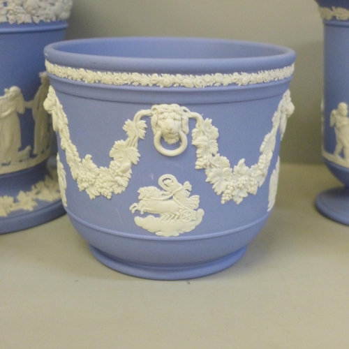 2048 - A collection of Wedgwood Jasperware, five vases and a planter