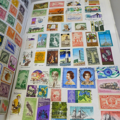 2056 - A collection of stamp albums containing worldwide stamps, commemorative crowns and a Days Gone model... 