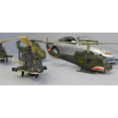 2057 - A collection of Corgi die-cast vehicles including two James Bond 007 cars and a Chevrolet, four heli... 