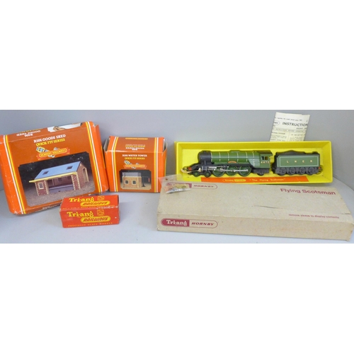 2064 - A Tri-ang Hornby OO gauge model Flying Scotsman, a boxed wagon and two buildings, R505 and R506, Wat... 