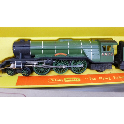 2064 - A Tri-ang Hornby OO gauge model Flying Scotsman, a boxed wagon and two buildings, R505 and R506, Wat... 