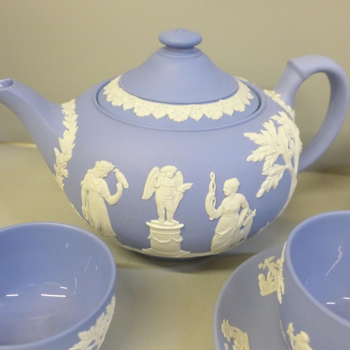 2082 - Wedgwood Jasperware teawares; a teapot, cup and saucer, milk and cream jug, sugar bowl and coffee cu... 