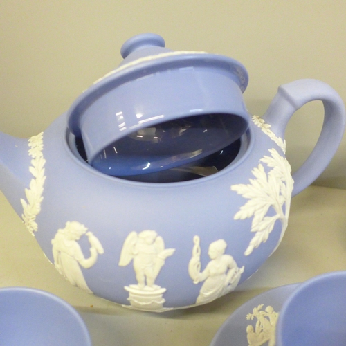 2082 - Wedgwood Jasperware teawares; a teapot, cup and saucer, milk and cream jug, sugar bowl and coffee cu... 