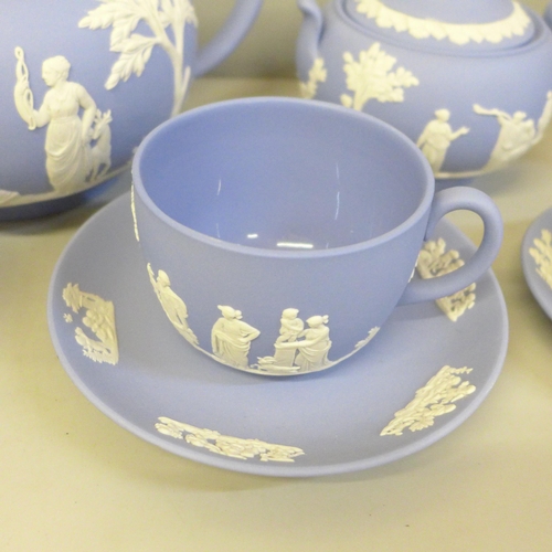 2082 - Wedgwood Jasperware teawares; a teapot, cup and saucer, milk and cream jug, sugar bowl and coffee cu... 