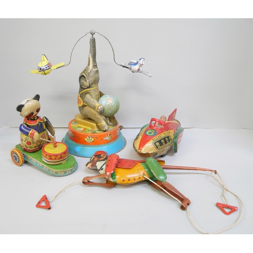 2126 - Four tin-plate toys including Jet Racer