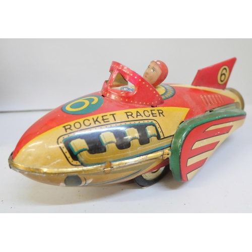 2126 - Four tin-plate toys including Jet Racer