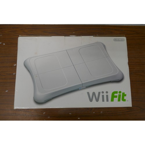 5117A - Two Nintendo WII first generation gaming consoles with genuine and after market accessories  all lea... 