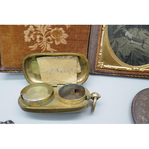 2184 - A Victorian leather cased daguerrotype, a cased thermometer, a double sovereign case and a framed po... 