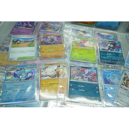 2190 - 69 Japanese holographic Pokémon cards in protective sleeves