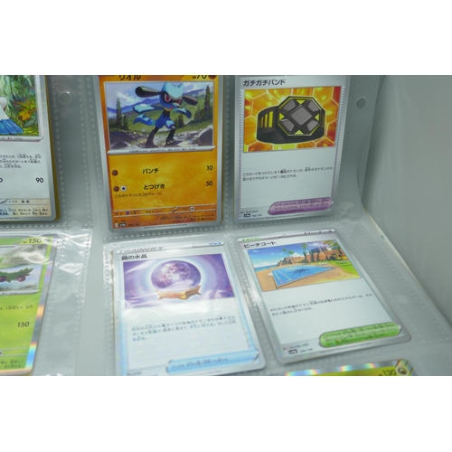 2190 - 69 Japanese holographic Pokémon cards in protective sleeves