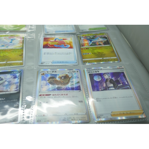 2190 - 69 Japanese holographic Pokémon cards in protective sleeves