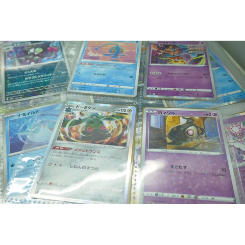 2190 - 69 Japanese holographic Pokémon cards in protective sleeves