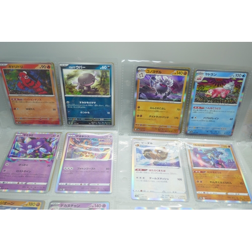 2190 - 69 Japanese holographic Pokémon cards in protective sleeves