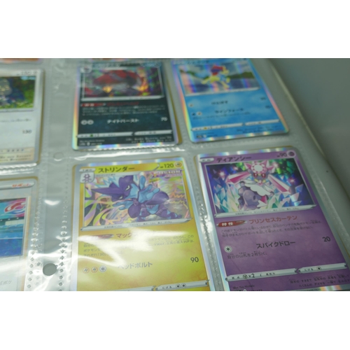 2190 - 69 Japanese holographic Pokémon cards in protective sleeves