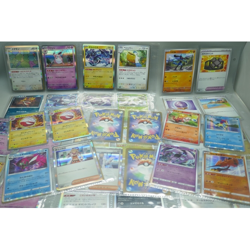 2190 - 69 Japanese holographic Pokémon cards in protective sleeves