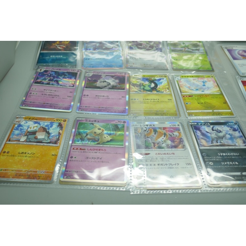 2190 - 69 Japanese holographic Pokémon cards in protective sleeves