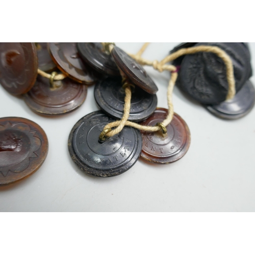 2194 - Fifteen horn buttons; one set with fox head, one set with birds