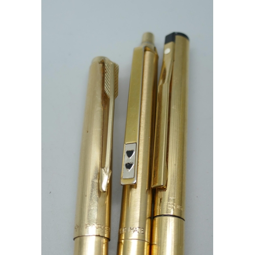 2197 - Three gold plated pens, a Sheaffer fountain pen, a Parker ballpoint and a Paper Mate ballpoint