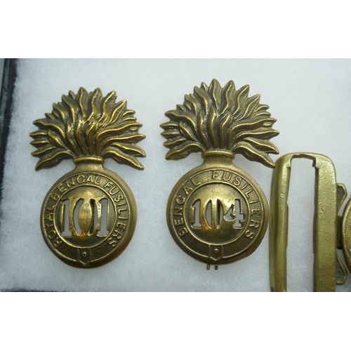 2206 - A collection of military regimental badges, mainly 19th century, also a buckle