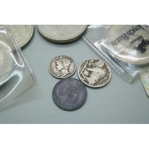 2218 - A collection of British and foreign coins including a Marie Theresa coin and two Five Pounds coins