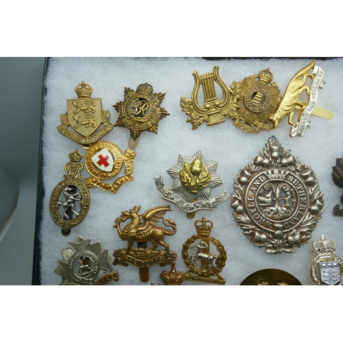 2219 - A collection of military regimental cap badges