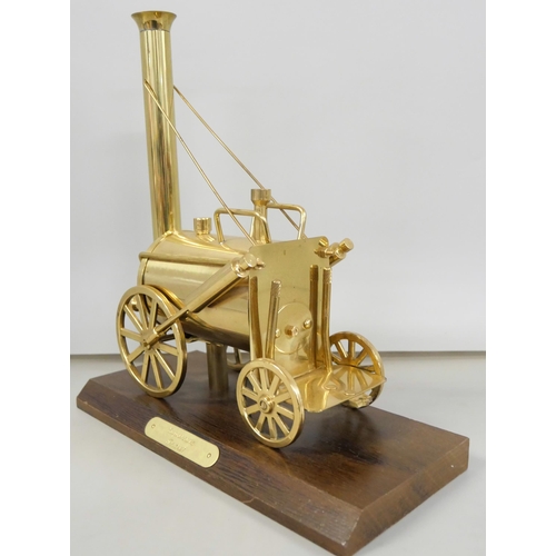 2223 - A brass model of Stephenson's Rocket on a wooden plinth