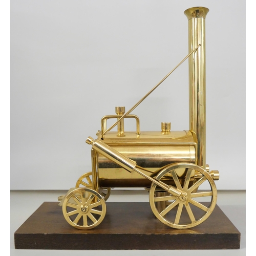 2223 - A brass model of Stephenson's Rocket on a wooden plinth