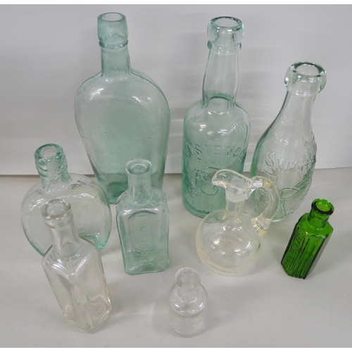 2242 - A collection of advertising glass bottles including a poison bottle  **PLEASE NOTE THIS LOT IS NOT E... 