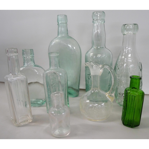 2242 - A collection of advertising glass bottles including a poison bottle  **PLEASE NOTE THIS LOT IS NOT E... 