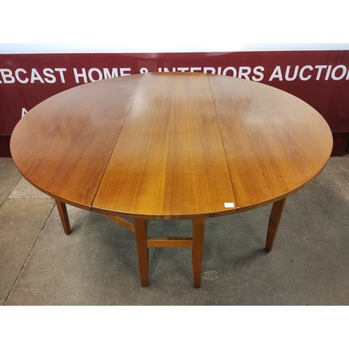 63C - A teak drop-leaf table