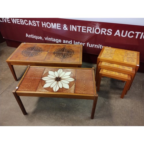 63G - Two teak and tiled top coffee tables and a nest of tables