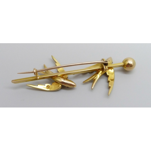 7001 - A 15ct gold brooch depicting two swallows set with seed pearls and with ruby eyes, 7.1g, 57mm