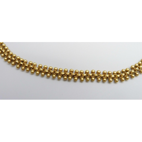 7005 - A Victorian yellow metal choker necklace, 17.6g, 42cm