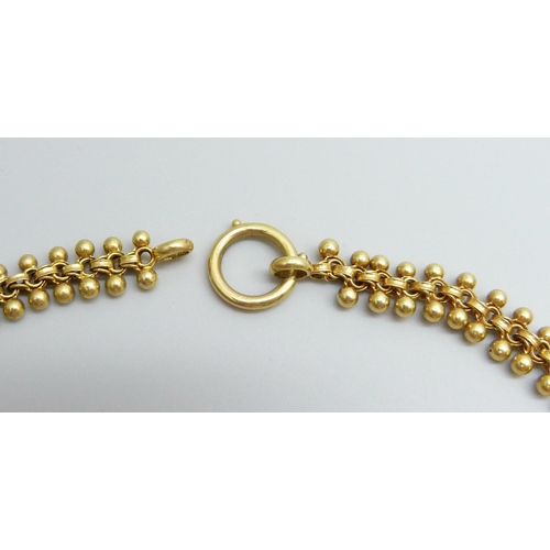 7005 - A Victorian yellow metal choker necklace, 17.6g, 42cm