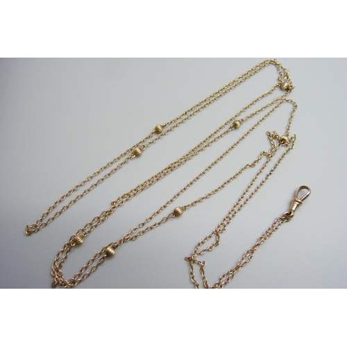 7012 - A Victorian 9ct gold long guard chain, 10g