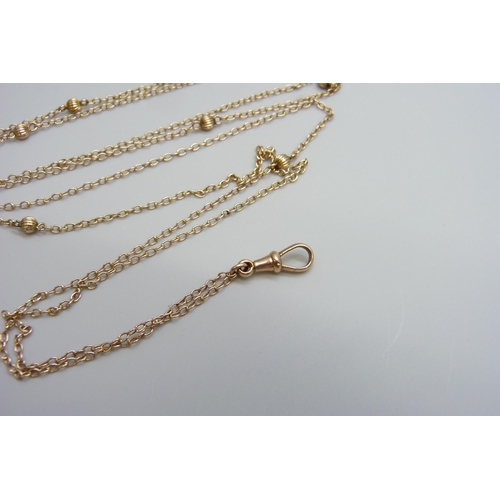 7012 - A Victorian 9ct gold long guard chain, 10g