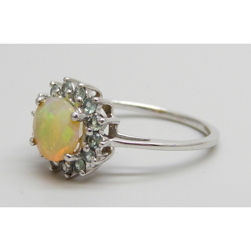 7016 - A 9ct white gold ring set with an Ethiopian opal and blue green stones, 2g, N/O