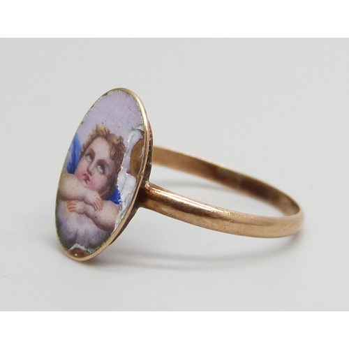 7027 - A yellow metal ring with enamelled cherub detail, 1.1g, M, enamel a/f