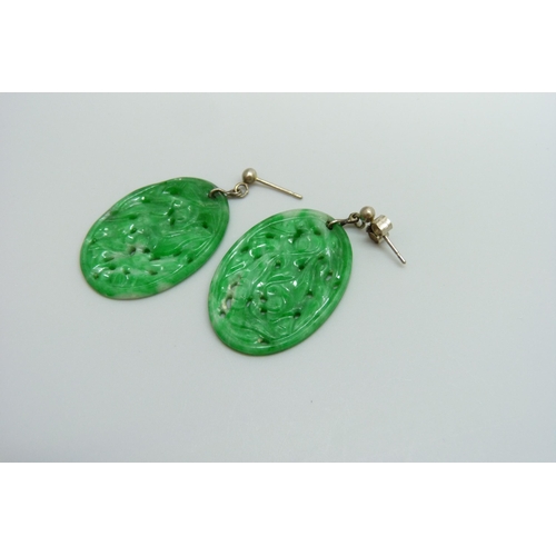 7035 - A pair of jade earrings, 21mm x 30mm, (with one fastener marked 750)