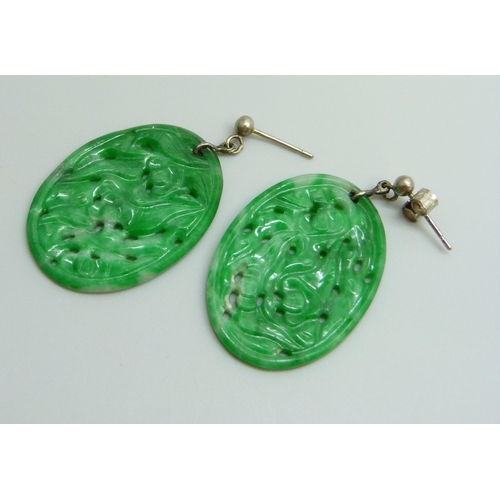 7035 - A pair of jade earrings, 21mm x 30mm, (with one fastener marked 750)