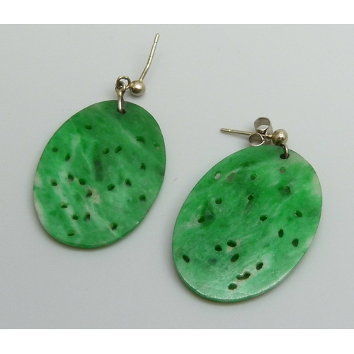 7035 - A pair of jade earrings, 21mm x 30mm, (with one fastener marked 750)